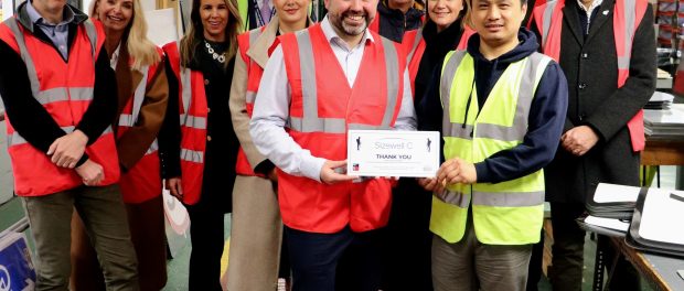 Left - Malcolm Dare, Supply Chain Director at Sizewell C. Sizewell C's Ben Pritchard is presented with a ‘Thank You’ plaque by RBLI veteran Anil Gurang