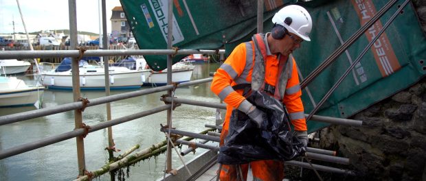 GEO206 - Close up of engineer working on Bridport Harbour